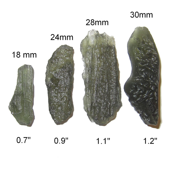 four natural green moldavite crystals to show size difference