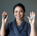 sheila of satin crystals holding black moonstone palm stones