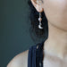 sheila of satin crystals wearing peach moonstone sterling silver crescent moon dangle earrings