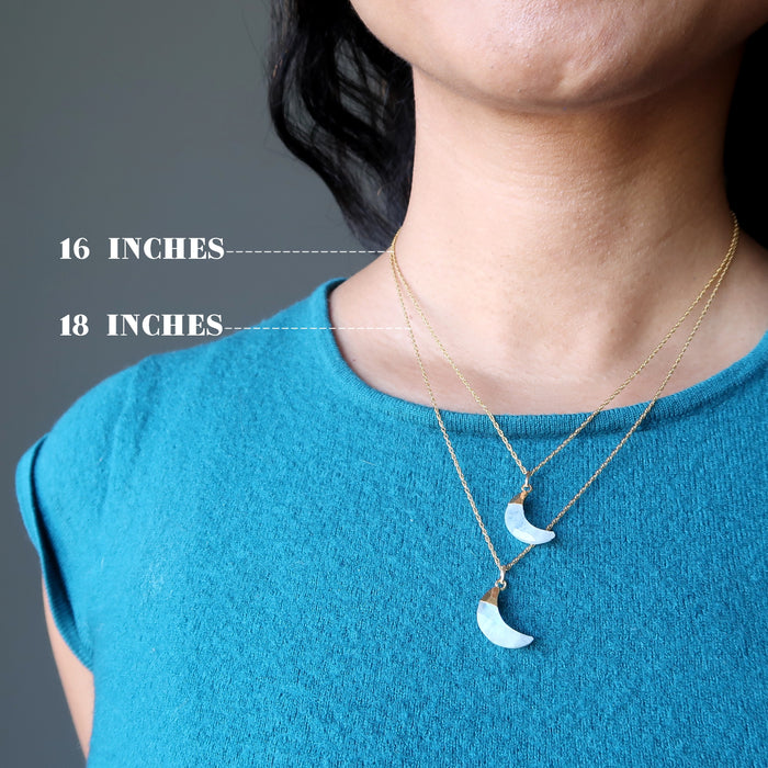 woman modeling moonstone moon necklaces to show different lengths