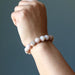 female wearing peach moonstone bracelet 