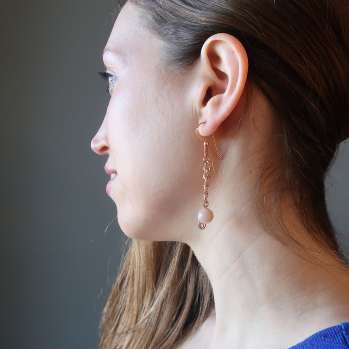holly of satin crystals wearing pink moonstone copper chain earrings
