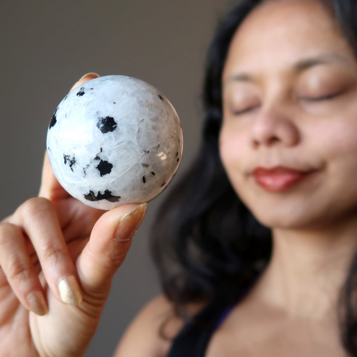 meditating with  moonstone tourmaline sphere