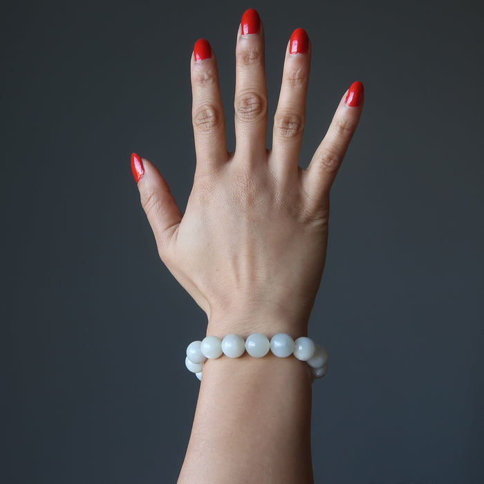 hand wearing white moonstone bracelet