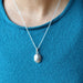 female wearing silver muonionalusta oval necklace