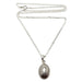 silver muonionalusta oval necklace on sterling silver curb chain with spring clasp
