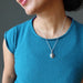 female wearing silver muonionalusta oval necklace
