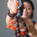 sheila of satin crystals dropping essential oils on her obsidian lava bracelets