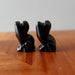 back of two 1" Black Obsidian Cats on wooden table