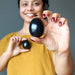 sheila of satin crystals holding two black obsidian eggs