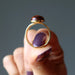 hand holding mahogany obsidian gold ring