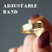 hand holding mahogany obsidian gold ring showing adjustable band