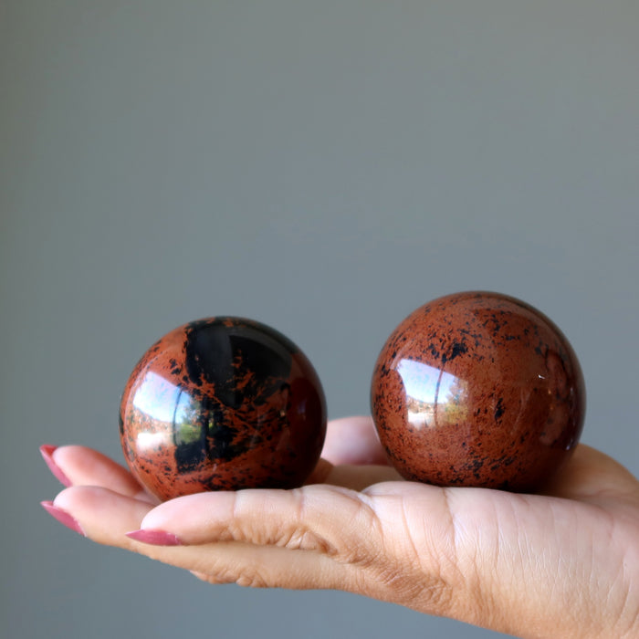 mahogany obsidian spheres in hand