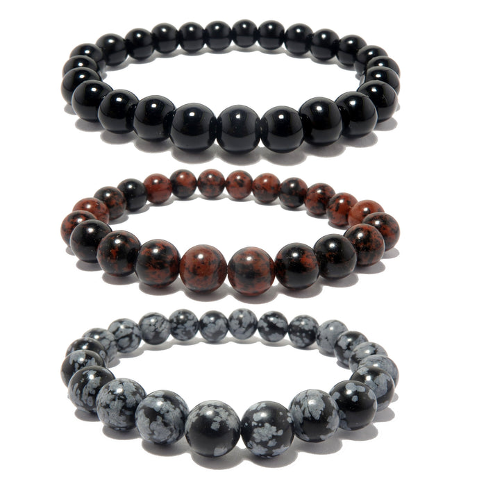 a trio of obsidian bracelets in black mahogany and snowflake