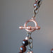 copper toggle clasp on triple strand obsidian necklace
