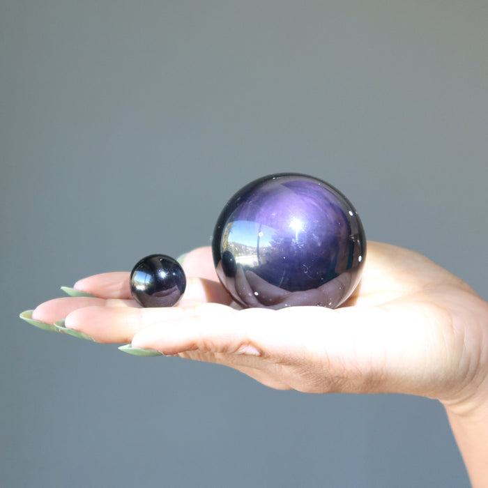 purple obsidian spheres in hand
