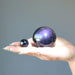 purple obsidian spheres in hand