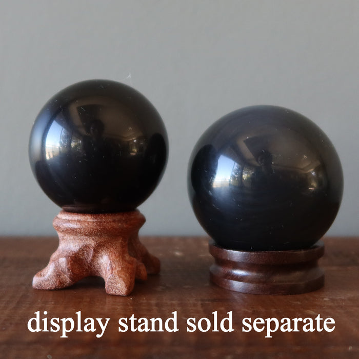 two rainbow obsidian spheres on stands