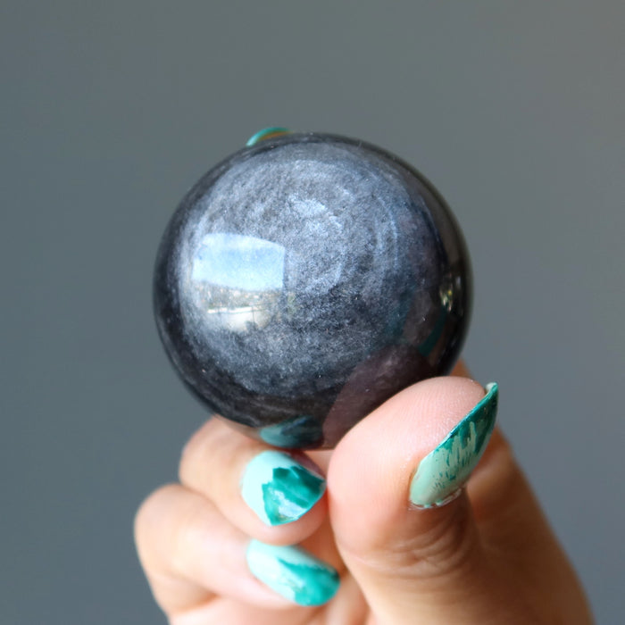 holding Silver Sheen Obsidian Sphere