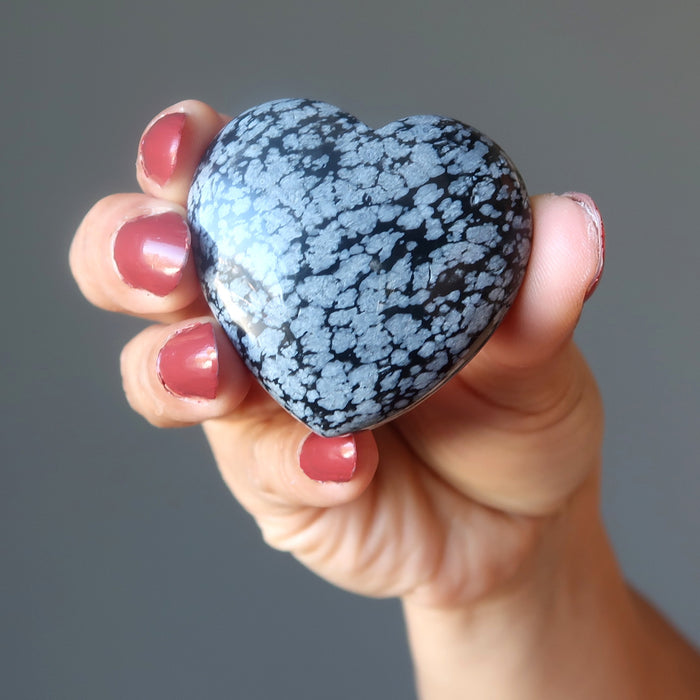 hand holding Snowflake Obsidian Heart