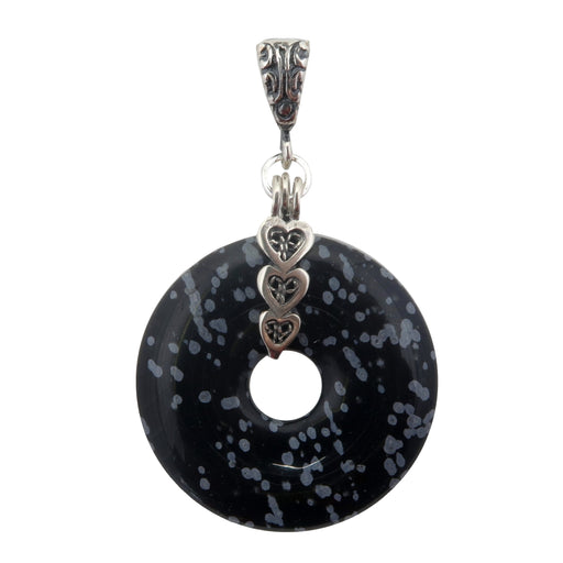 Black and gray snowflake like Obsidian polished into a donut shape and hung from a sterling silver triple heart pendant
