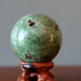 green opal sphere on display stand