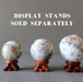 3 white opal sphere on wood display stands