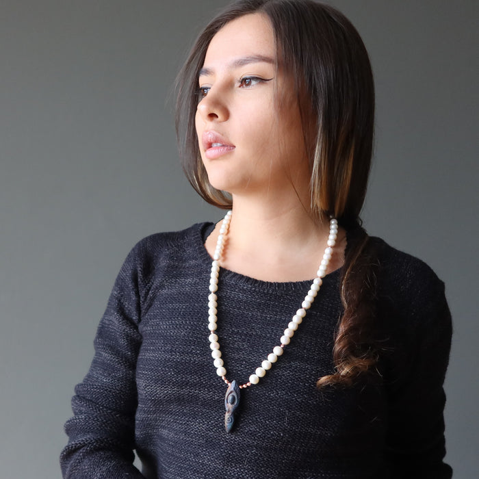 woman modeling pearl goddess necklace