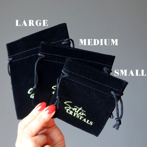 black velveteen pouch with gold "satin crystals" prints in large, medium and small sizes