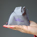 gray velvetten pouch with purple "satin crystals" print in palm of hand