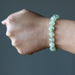 spring green prehnite gemstone bracelet on a lady's wrist