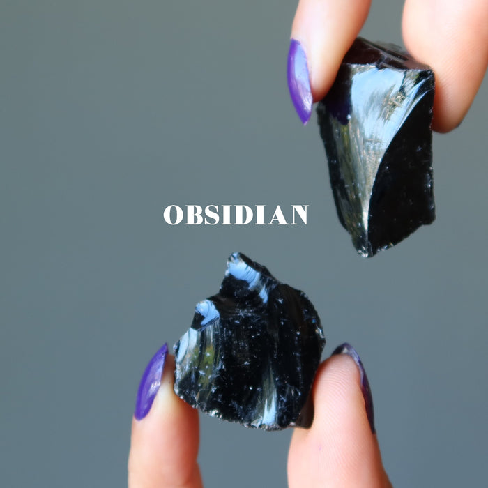 two black obsidian raw stones