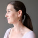 lucia of satin crystals wearing faceted pyrite beads on gold spiral earrings