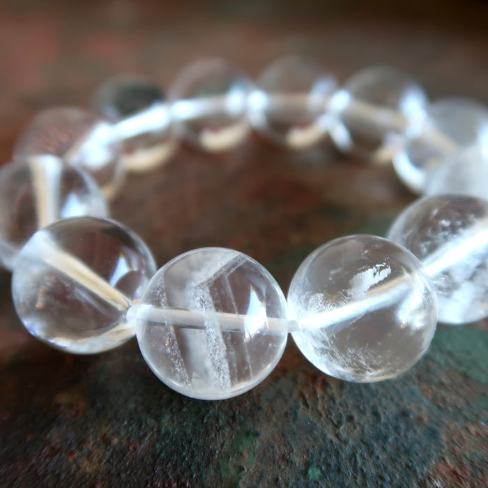 close up view of clear quartz round bead inclusions