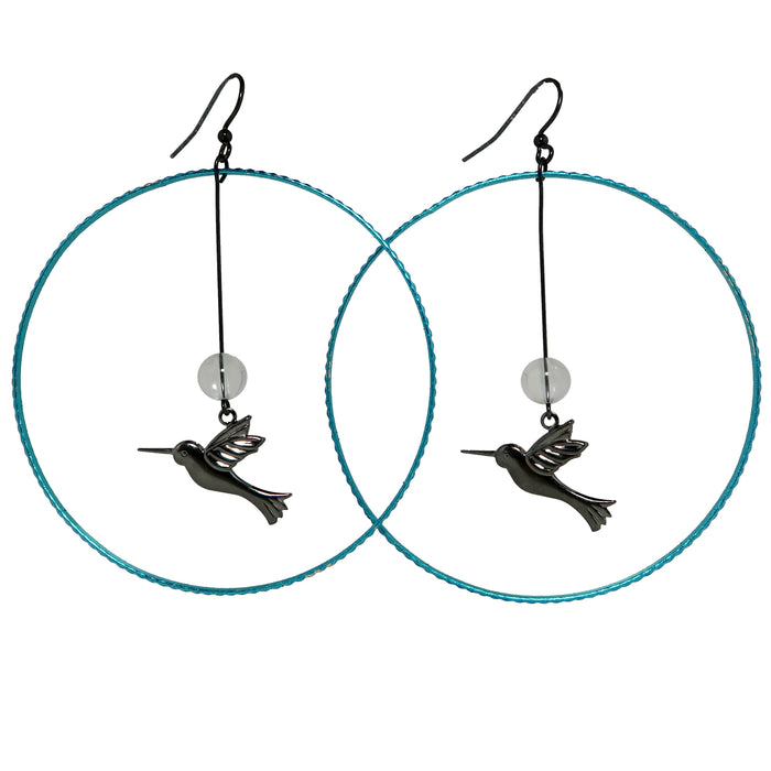 clear quartz beads hanging with hummingbird charms in blue hoop earrings