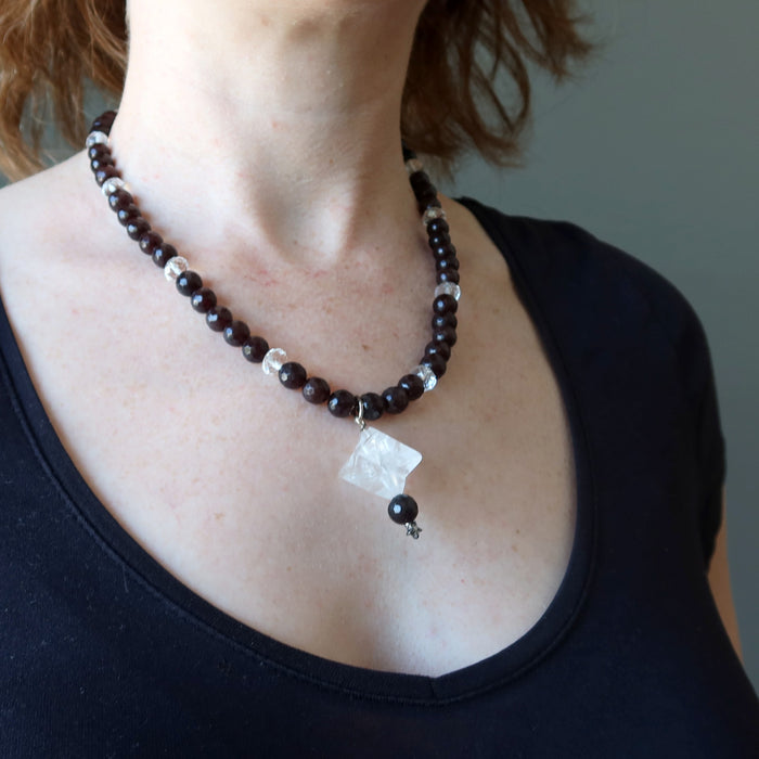 female wearing clear quartz merkaba chalcedony necklace