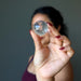 sheila of satin crystals holding clear quartz sphere