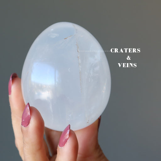 showing craters and veins on Cloud Quartz Egg 