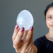 sheila of satin crystals holding Cloud Quartz Egg 