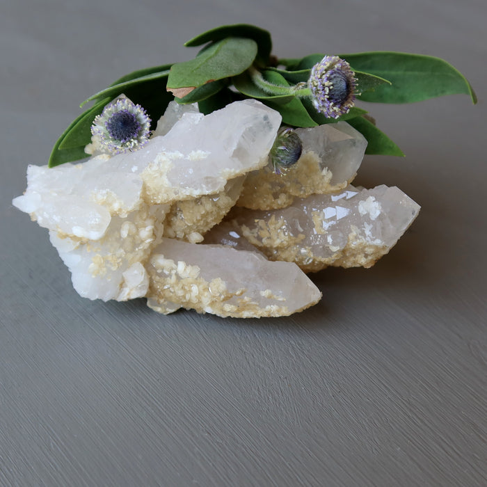 raw white quartz cluster and flowers