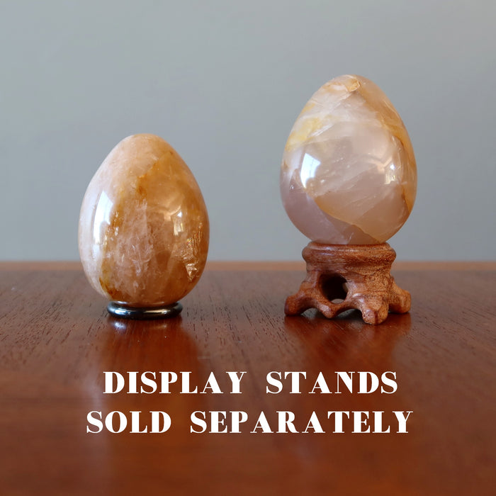 two Golden Quartz Eggs on the stands