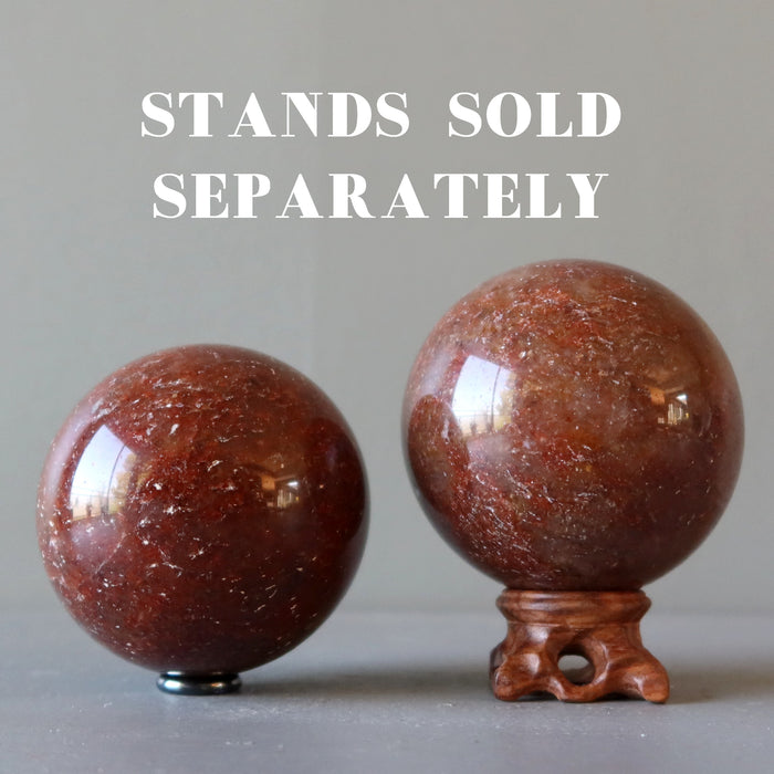 two red quartz spheres on stands