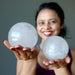 woman holding included quartz spheres