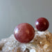 pink quartz spheres on quartz cluster