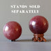 two pink quartz spheres on stands