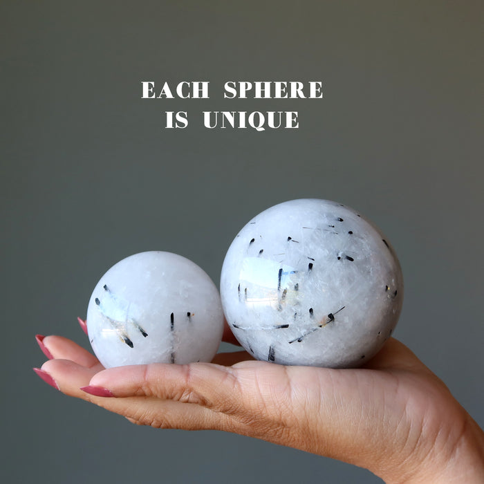 quartz tourmaline spheres in hand