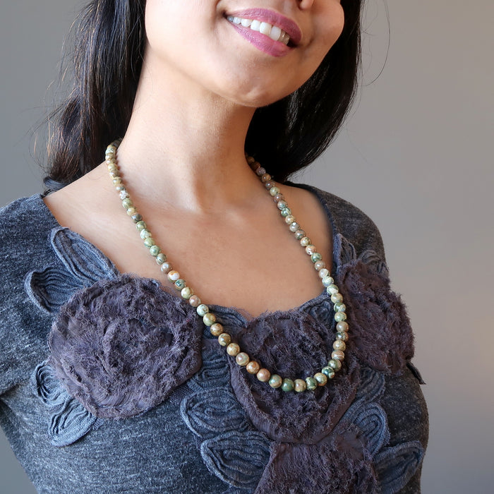 female wearing rhyolite necklace