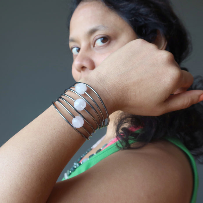 Jewelry designer Sheila Satin displays a 7 layer memory wire Rose Quartz bracelet on her hand
