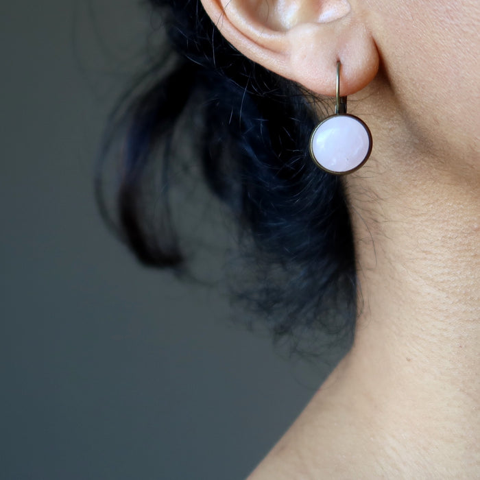 ear wearing rose quartz earrings