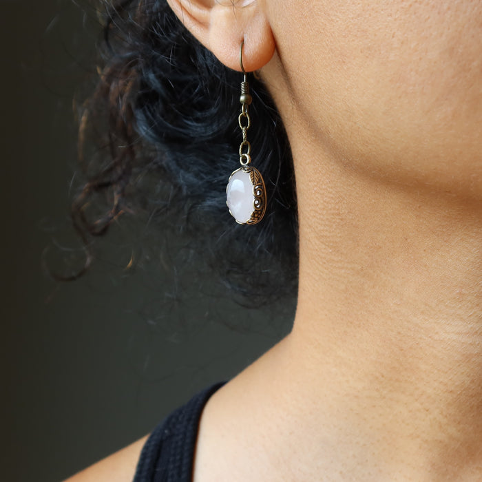 rose quartz earring on ear